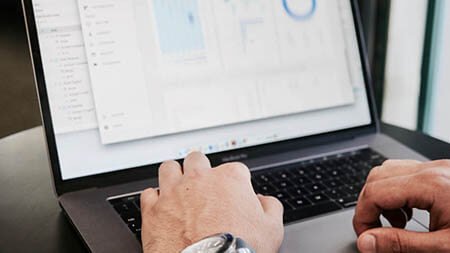 Men's hands on keyboard of a laptop